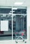 Lone shopping cart in supermarket entrance hall with empty banner