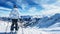 Lone single one skier standing at the peak of snowy mountain, clear blue sky