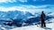 Lone single one skier standing at the peak of snowy mountain, clear blue sky