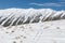 Lone ski track on snow on mountain slope