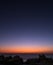 Lone star in dark blue sky over sunset on Atlantic ocean