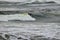 Lone Surfboard Rider in Rough Storm Waves