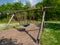 Lone swing seat in a summer field