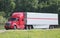 Lone tractor-trailer on an interstate highway.