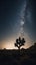 A lone tree in the desert under a starry sky. Generative AI image.