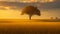 A lone tree standing tall in the middle of a golden field