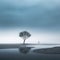 a lone tree stands in the middle of a lake