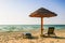 A lone umbrella on the beach of the Arabian Gulf in Dubai. Summer 2016.