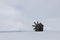 Lone windmill, don Quixote, snow field, Russian village
