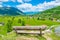 A lone wooden bench stands on top