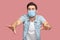 Loneless and blindness. Portrait of lost worry man with surgical medical mask in blue shirt standing with closed eyes and try to