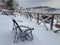 Loneliness bench in winter with snow.