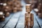 Loneliness portrayed, a wooden man on a blurry wooden background