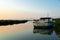 Lonely abandoned fishing boat at sunrise in ebro delta park in catalunya, a quiet scene symbol of loneliness and peace of mind