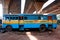 Lonely abandoned multicolored bus stands under the motorway