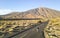 Lonely adventure travel photographer walking at Teide National P