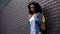 Lonely afro-american schoolgirl standing college backyard, puberty insecurities