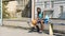 Lonely Afro-American sportsman sitting on bench and holding ball, depression