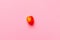 Lonely Apricot isolated over a fuscia background