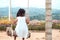 Lonely asian little child girl sitting on wooden swings