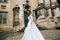 Lonely beautiful bride in a white dress walking in old city. wedding concept