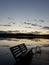 Lonely bench in the awesome sunrise