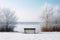 A lonely bench in a calm winter landscape