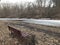 Lonely bench by the icy river