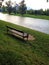 Lonely bench on a river bank