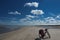 Lonely bike of a traveller on oceanic beach, summer