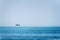 Lonely blue fishing trawler in the sea