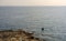 Lonely boat floating on the Mediterranean sea near Sliema coastline, Malta