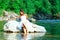 Lonely bride in a rock by the river