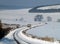 Lonely bus climbing on a winter road