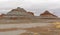 Lonely Buttes in the Cloudy Desert