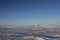 Lonely cabin along an arctic landscape with snow on the ground