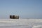 Lonely cabin in a snow landscape on the arctic tundra