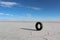 Lonely car tire in the salt lakes of Bolivia