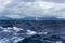 Lonely catamaran in turbulent Pacific Ocean