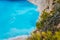 Lonely catamaran yacht in blue bay of Navagio beach. Azure turquoise sea water pattern near paradise sandy beach. Famous