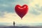 Lonely Child With Symbolic Red Balloon in The Shape of Heart