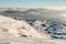 Lonely Cottage high in the Mountain in a snowy Winter Landscape