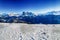 Lonely cottage on white snowy mountains