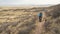 Lonely cyclist riding fat mountain bike on a prairie