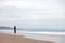 Lonely and depressed woman watching the sea