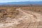 Lonely desert dirt and gravel road in rural New Mexico