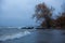 Lonely desolate beach at stormy weather