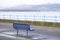 Lonely empty bench in open esplanade tranquil space on Scottish west coast town in Greenock