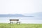 Lonely empty bench in open tranquil space on Scottish west coast town in Argyll and Bute
