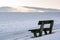 Lonely and empty bench - winter landscape